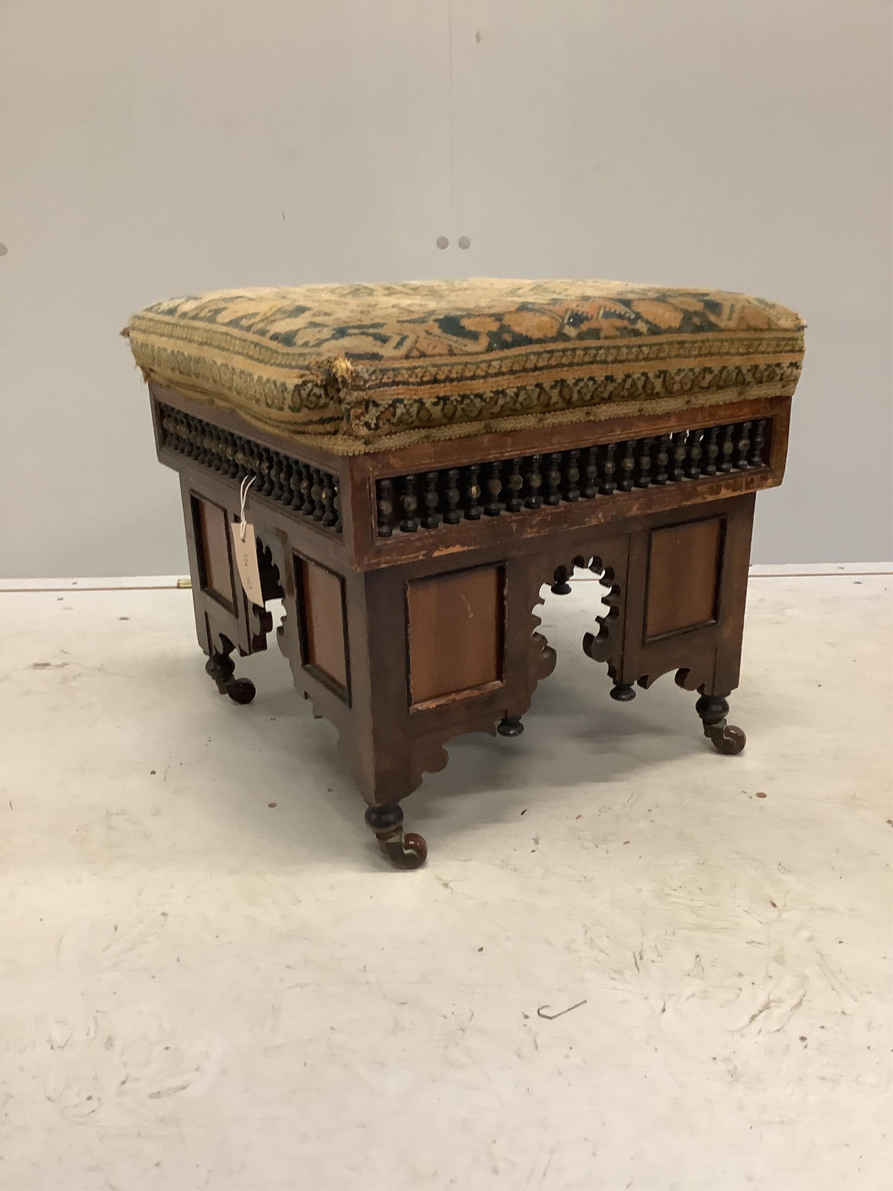 A Moorish style dressing stool in the manner of Liberty & Co, width 44cm, depth 44cm, height 41cm. Condition - fair